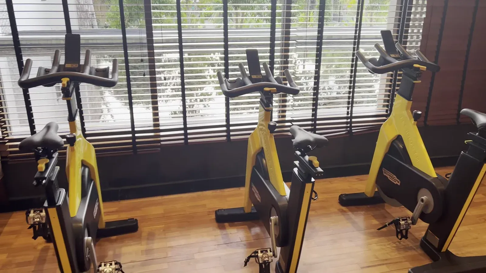 The fitness centre at The Sira Lombok, with spin bikes facing the sea